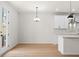 Open dining area adjacent to the kitchen with a door to the backyard at 1016 Rose Dr, Marietta, GA 30060