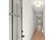 Inviting hallway with light-colored wood floors and neutral wall colors at 1016 Rose Dr, Marietta, GA 30060