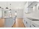 Bright, modern kitchen with sleek white cabinets, stainless steel appliances, and a spacious island at 1016 Rose Dr, Marietta, GA 30060