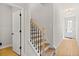 Bright staircase with natural wood treads and white risers and walls at 1016 Rose Dr, Marietta, GA 30060