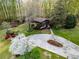 Aerial view of a charming home surrounded by mature trees and lush landscaping at 1039 Smyrna Rd Sw, Conyers, GA 30094