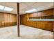 Spacious basement featuring built-in cabinets and ample counter space, perfect for a home bar or kitchenette at 1039 Smyrna Rd Sw, Conyers, GA 30094