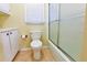 Bright bathroom with a tub and shower combo behind a glass enclosure at 1039 Smyrna Rd Sw, Conyers, GA 30094