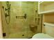 Modern bathroom featuring a tiled shower with glass door and built-in shower seat and cubbies at 1039 Smyrna Rd Sw, Conyers, GA 30094