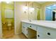 Bathroom featuring white vanity and hanging light fixtures at 1039 Smyrna Rd Sw, Conyers, GA 30094