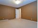 A bedroom with a large closet and a ceiling light fixture, and an open doorway at 1039 Smyrna Rd Sw, Conyers, GA 30094
