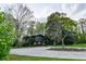 Charming two-story home with mature trees and an expansive driveway at 1039 Smyrna Rd Sw, Conyers, GA 30094