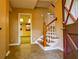 Entryway features tiled floors, a staircase leading to the upper level and front door with windows at 1039 Smyrna Rd Sw, Conyers, GA 30094