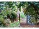 Idyllic garden scene with a gate framed by blooming bushes creating a serene outdoor retreat at 1039 Smyrna Rd Sw, Conyers, GA 30094