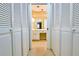 Hallway view of closet with double doors leading to bathroom at 1039 Smyrna Rd Sw, Conyers, GA 30094