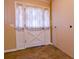 Hallway features a tiled floor, closet, and a decorative barn-style door with sidelights at 1039 Smyrna Rd Sw, Conyers, GA 30094