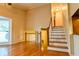 Open living space with natural light from a large bay window and staircase at 1039 Smyrna Rd Sw, Conyers, GA 30094
