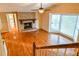 Bright living room with hardwood floors, fireplace, and natural light from a large window at 1039 Smyrna Rd Sw, Conyers, GA 30094