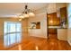 Open concept living space featuring hardwood flooring, open breakfast bar and kitchen access at 1039 Smyrna Rd Sw, Conyers, GA 30094