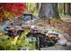 Landscaped backyard with a serene pond and mini-waterfall, perfect for a relaxing outdoor retreat at 1039 Smyrna Rd Sw, Conyers, GA 30094