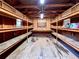 Interior shed with wooden shelves and ceiling fan, offering storage and organization space for tools and equipment at 1039 Smyrna Rd Sw, Conyers, GA 30094