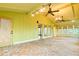 Large sunroom with yellow walls, brick floors, and lots of natural light at 1039 Smyrna Rd Sw, Conyers, GA 30094