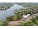 Aerial view of a lakeside community, featuring a swimming pool and various amenities by the water at 13070 Tidewater Xing, Alpharetta, GA 30005