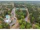 Aerial shot of community amenities, including tennis courts, a swimming pool, and well-maintained landscaping at 13070 Tidewater Xing, Alpharetta, GA 30005
