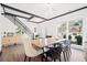 Cozy dining room with modern lighting, wood floors, and a large window at 13070 Tidewater Xing, Alpharetta, GA 30005