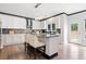Bright kitchen with white cabinetry, granite countertops, central island, and stainless steel appliances at 13070 Tidewater Xing, Alpharetta, GA 30005