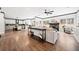 Spacious living room with wood floors, neutral walls, fireplace, and an open layout at 13070 Tidewater Xing, Alpharetta, GA 30005