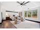 Spacious main bedroom featuring a trey ceiling, ceiling fan, and sitting area at 13070 Tidewater Xing, Alpharetta, GA 30005