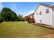 Expansive backyard with well-maintained lawn and a lovely deck, perfect for Gathering gatherings at 195 Woodbridge Dr, Dallas, GA 30157