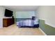 Spacious basement setup as a bedroom, complete with tile floors and a TV at 195 Woodbridge Dr, Dallas, GA 30157
