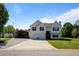 Charming two-story home with a well-maintained lawn, two-car garage, and covered parking on a sunny day at 195 Woodbridge Dr, Dallas, GA 30157