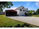 Charming home with garage and an additional vehicle parking. A welcoming sight for guests and residents alike at 195 Woodbridge Dr, Dallas, GA 30157