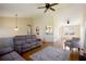 Spacious living room with hardwood floors, vaulted ceilings, modern lighting, and a comfortable seating area at 195 Woodbridge Dr, Dallas, GA 30157