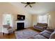 Bright living room showcasing a fireplace, vaulted ceilings, hardwood floors, and plenty of natural light at 195 Woodbridge Dr, Dallas, GA 30157