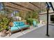 Back patio with a wicker roof and outdoor seating, perfect for relaxing and enjoying the view of the private yard at 2123 Juanita St, Decatur, GA 30032