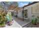 Charming outdoor patio features comfortable blue seating, a stylish pergola, and access to a beautiful backyard at 2123 Juanita St, Decatur, GA 30032