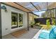 The covered back patio offers an enjoyable outdoor living space with seating, a walkway, and access to the yard at 2123 Juanita St, Decatur, GA 30032