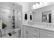 Bathroom featuring dual sinks, marble floors, and a large glass shower at 2123 Juanita St, Decatur, GA 30032