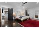 Bright bedroom offers dark wood flooring, natural light, and an open closet at 2123 Juanita St, Decatur, GA 30032