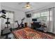 Versatile bedroom features exercise equipment, home office space, natural light, and modern ceiling fan at 2123 Juanita St, Decatur, GA 30032