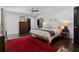 Spacious bedroom features a ceiling fan, closet, and a classic red rug at 2123 Juanita St, Decatur, GA 30032