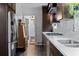 Galley kitchen with modern appliances, brick backsplash, and stainless steel refrigerator blends style with functionality at 2123 Juanita St, Decatur, GA 30032