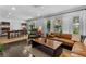 Spacious living room featuring hardwood floors, large windows with white curtains, and modern decor at 2123 Juanita St, Decatur, GA 30032