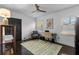 Bright home office space with wood floors, neutral walls, ceiling fan, and natural light from the window at 2123 Juanita St, Decatur, GA 30032