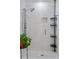 Modern shower features an adjustable shower head and a built-in shelf at 2123 Juanita St, Decatur, GA 30032