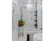 Modern shower featuring an adjustable shower head and sleek black storage at 2123 Juanita St, Decatur, GA 30032