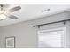 Bedroom wall with a window, light filtering shade and ceiling fan at 26 Hardpan Aly, Marietta, GA 30066
