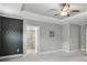 Bright bedroom with a decorative wall and an adjoining bathroom, offering a peaceful retreat at 26 Hardpan Aly, Marietta, GA 30066