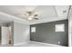 Spacious bedroom with tray ceiling, fan and neutral color palette, offering a serene retreat at 26 Hardpan Aly, Marietta, GA 30066