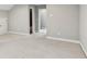 Large carpeted bedroom with doors to other rooms at 26 Hardpan Aly, Marietta, GA 30066