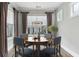 Cozy dining room with ample light from large windows and stylish decor at 26 Hardpan Aly, Marietta, GA 30066